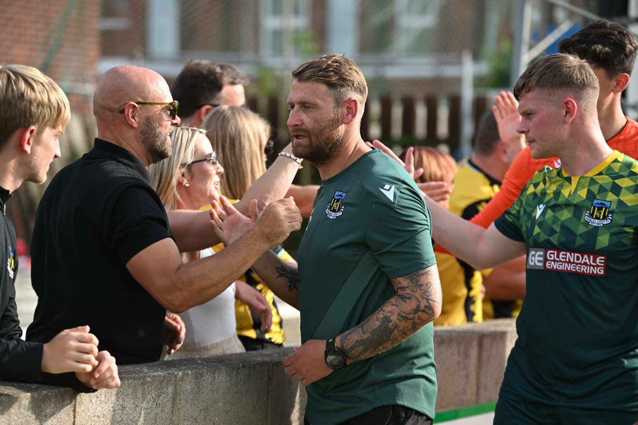 Hebburn Town manager and players greeting fans. Credit: Tyler’s Mission